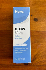 Hero Cosmetics Glow Balm in purse for on-the-go glow touch-ups