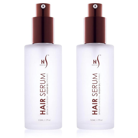 Herstyler Argan Oil Serum bottle glistens with natural shine for all hair types.