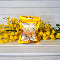 HIGH ALTITUDE ORGANICS Mimosa solid perfume application on skin demonstrates easy wear