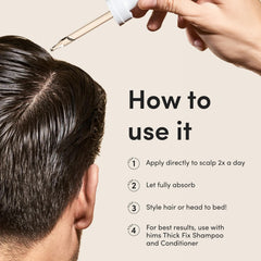 Hands applying drops to the scalp for targeted care.