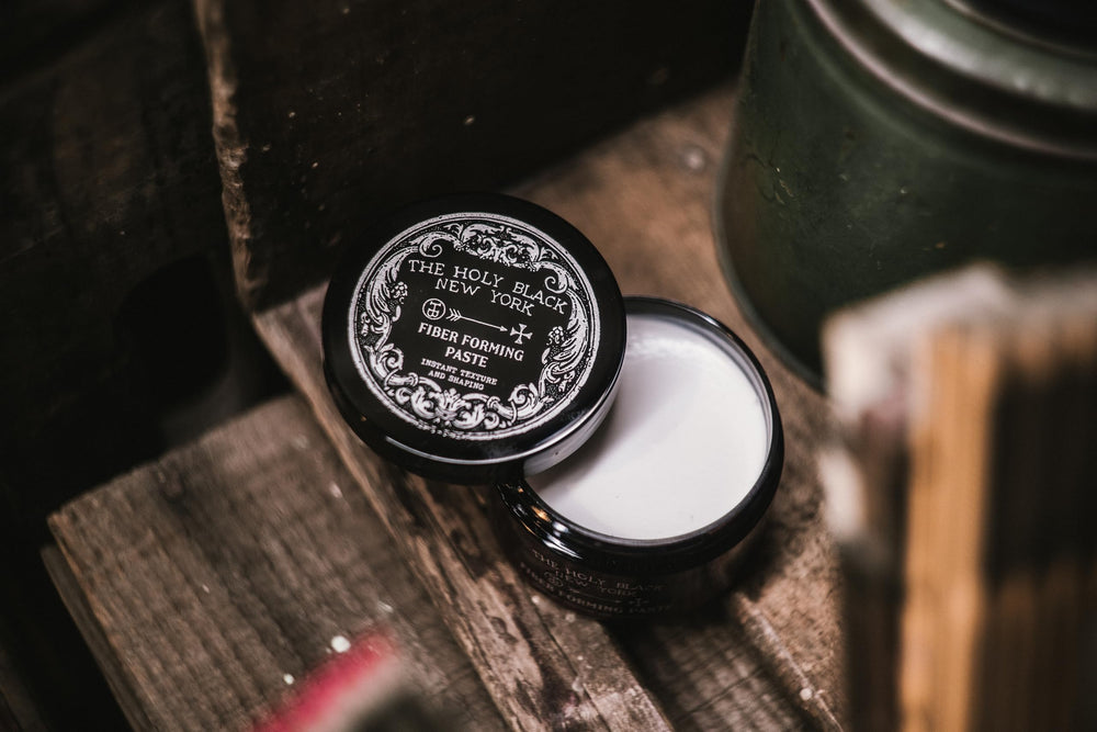 HOLY BLACK Fiber Forming Paste applied to hair creates texture and definition.
