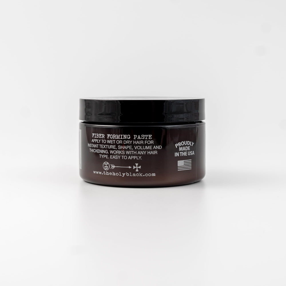 HOLY BLACK Fiber Forming Paste adds volume and thickness for fuller hair.