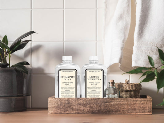 Home and Body Company Apothecary 101 Eucalyptus Mint refill bottle pouring for invigorating hands.