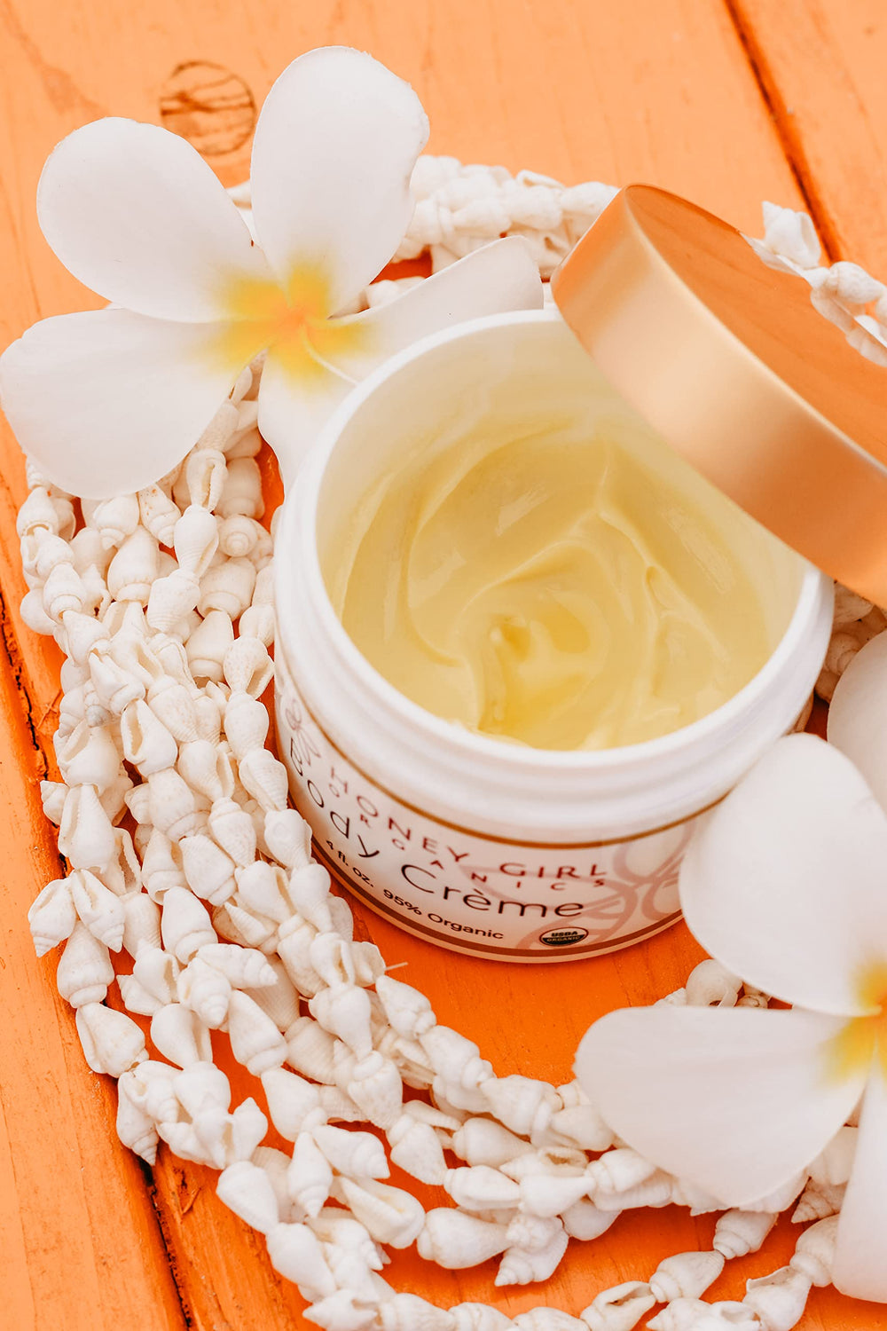 Honey Girl Organics Body Creme Hawaii craftsmanship image evokes natural ingredients.