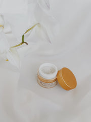 Honey Girl Organics honey jar close-up highlights natural ingredients for nourishing exfoliation.