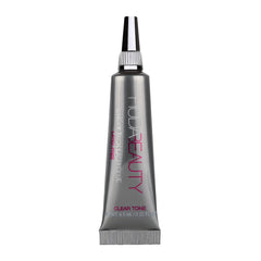 HUDA Beauty Sticky Tack Lash Glue bottle showing waterproof adhesion for all-day wear.