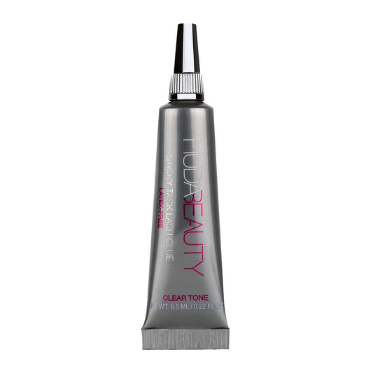 HUDA Beauty Sticky Tack Lash Glue brush illustrates precise, easy application.