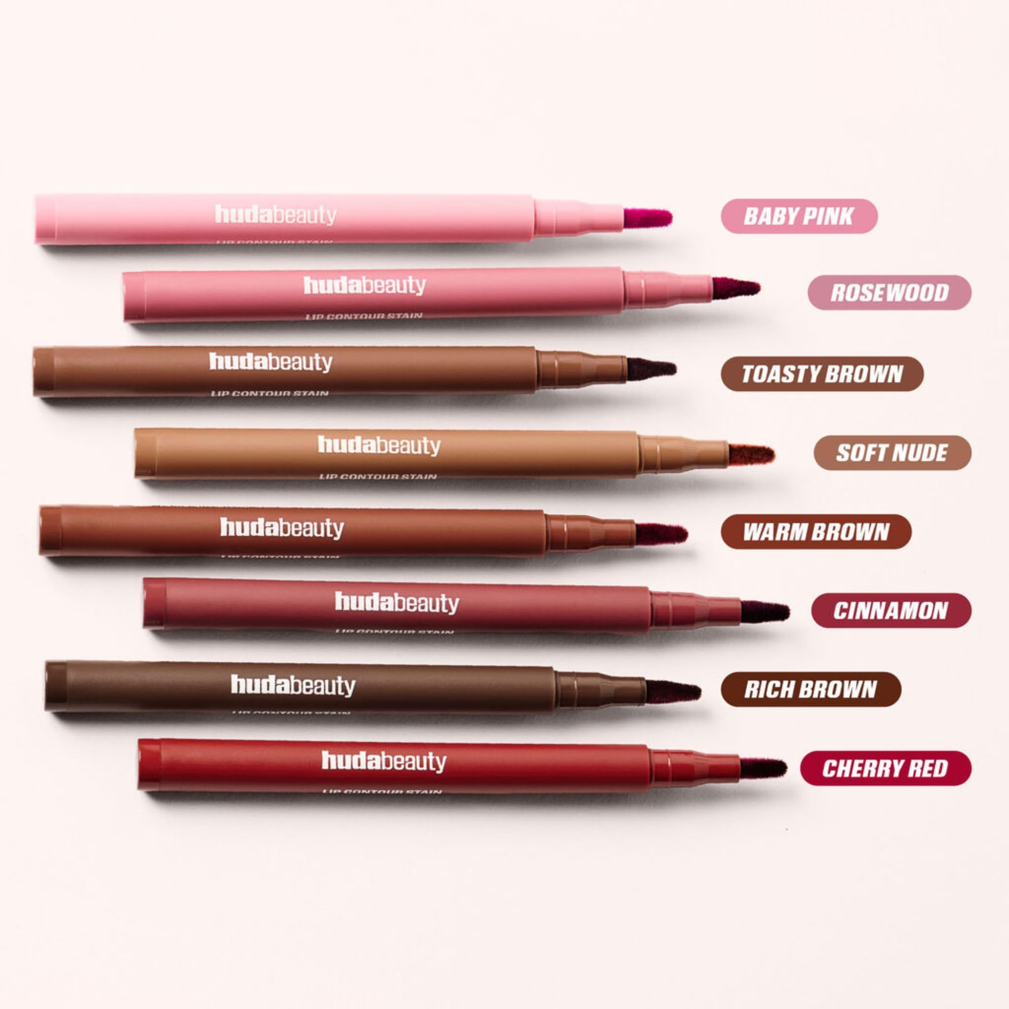 Huda Lip Contour Stain versatility across skin tones with warm brown shade.