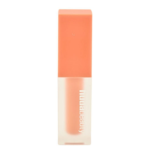Huda Beauty bottle close-up shows creamy texture for quick natural under-eye correction.