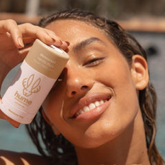 HUME Vanilla Daze deodorant stick in use delivering a dry, odor-free underarm feel.