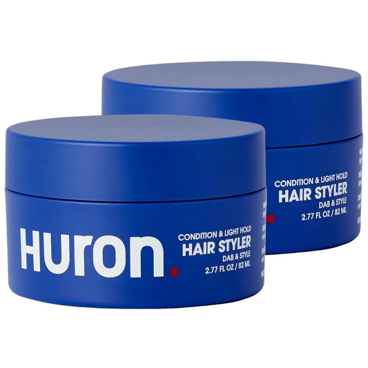 Huron Clean Citrus Woods bottle pour demonstrates easy daily styling and smooth application.