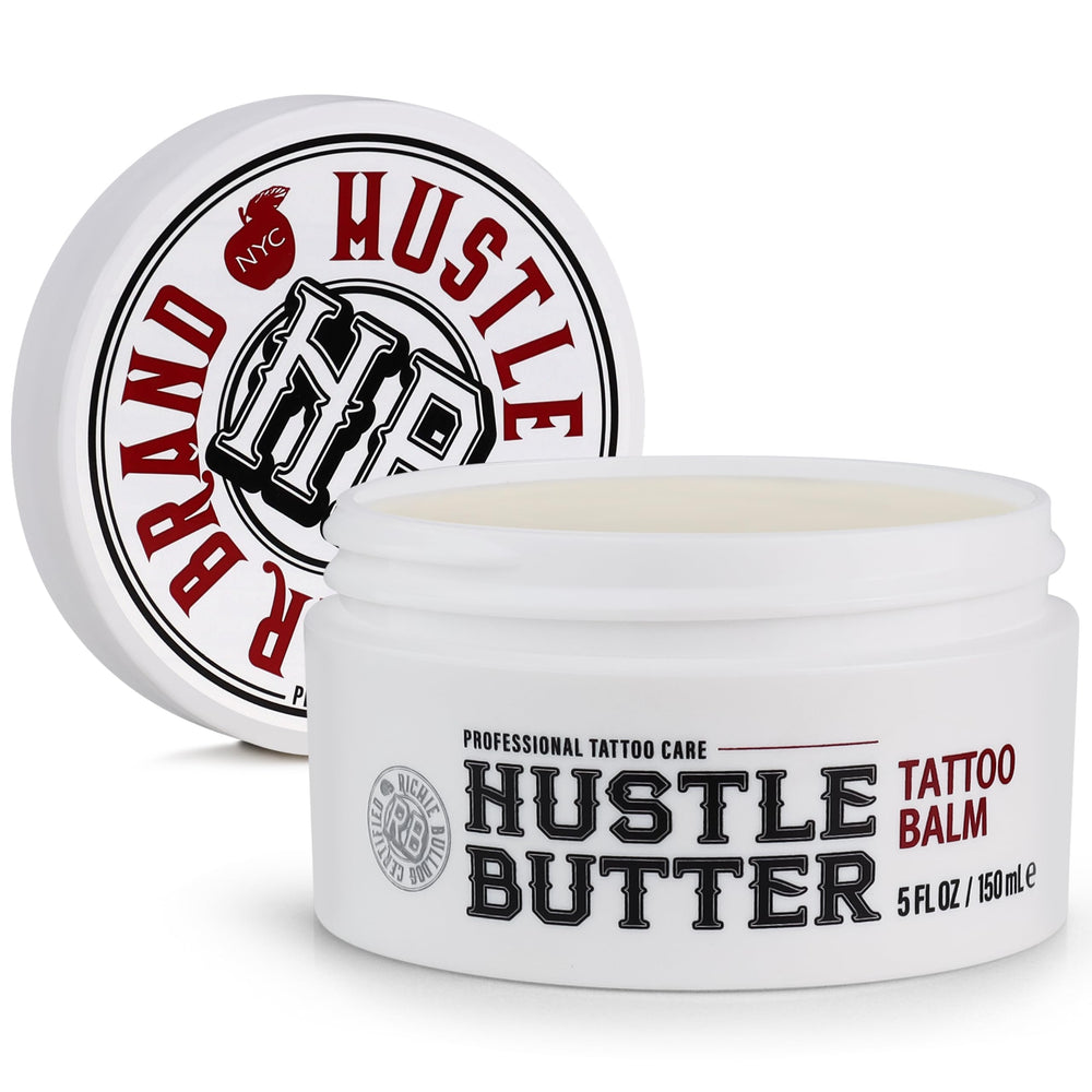 Hustle Butter Deluxe tattoo balm jar closeup showing creamy vegan formula for aftercare.