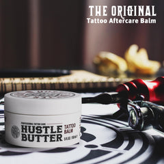 Hustle Butter Deluxe tattoo balm texture closeup highlights creamy, nourishing consistency.