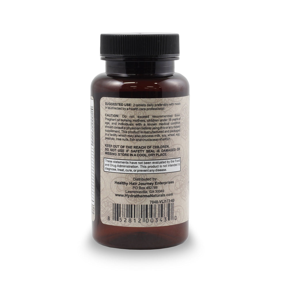 Hydratherma Naturals Hair Growth Plus bottle beside a glass of water for easy daily use.