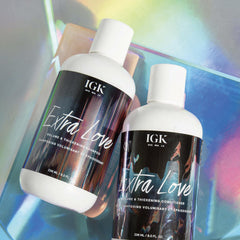 IGK Extra Love paired bottles in shower scene for oily-prone hair care.