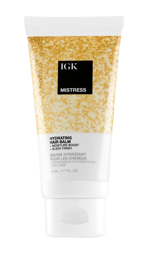 IGK Mistress hydrating hair balm travel bottle adds lightweight moisture for softness.