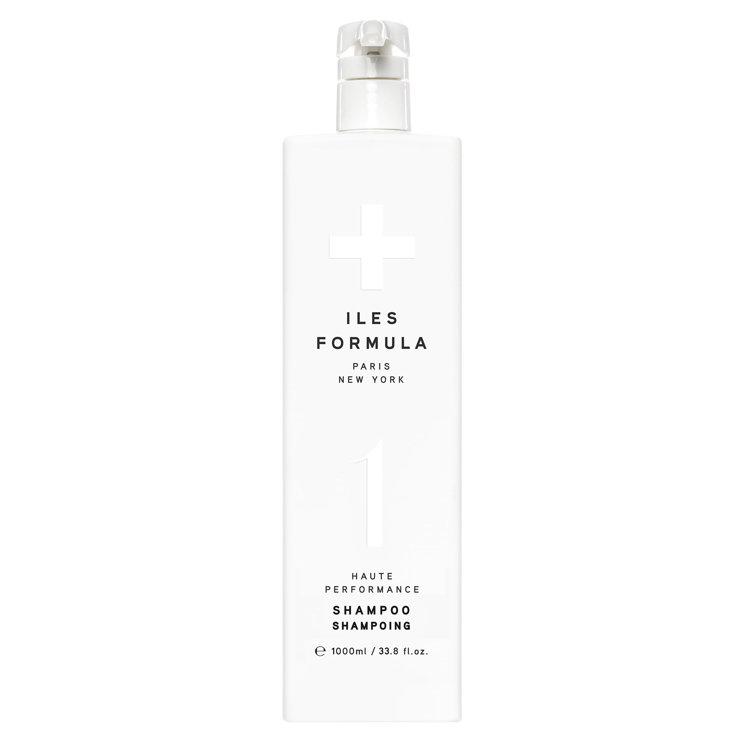 ILES FORMULA Shampoo bottle pouring hydrates hair for easy styling.