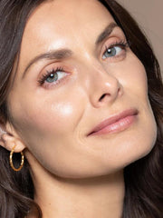 Lips tinted with subtle rose gold sheen from Stella by Starlight.