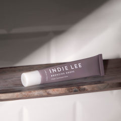 Indie Lee Bronzing Drops: blend into body lotion for bronzed shimmer.