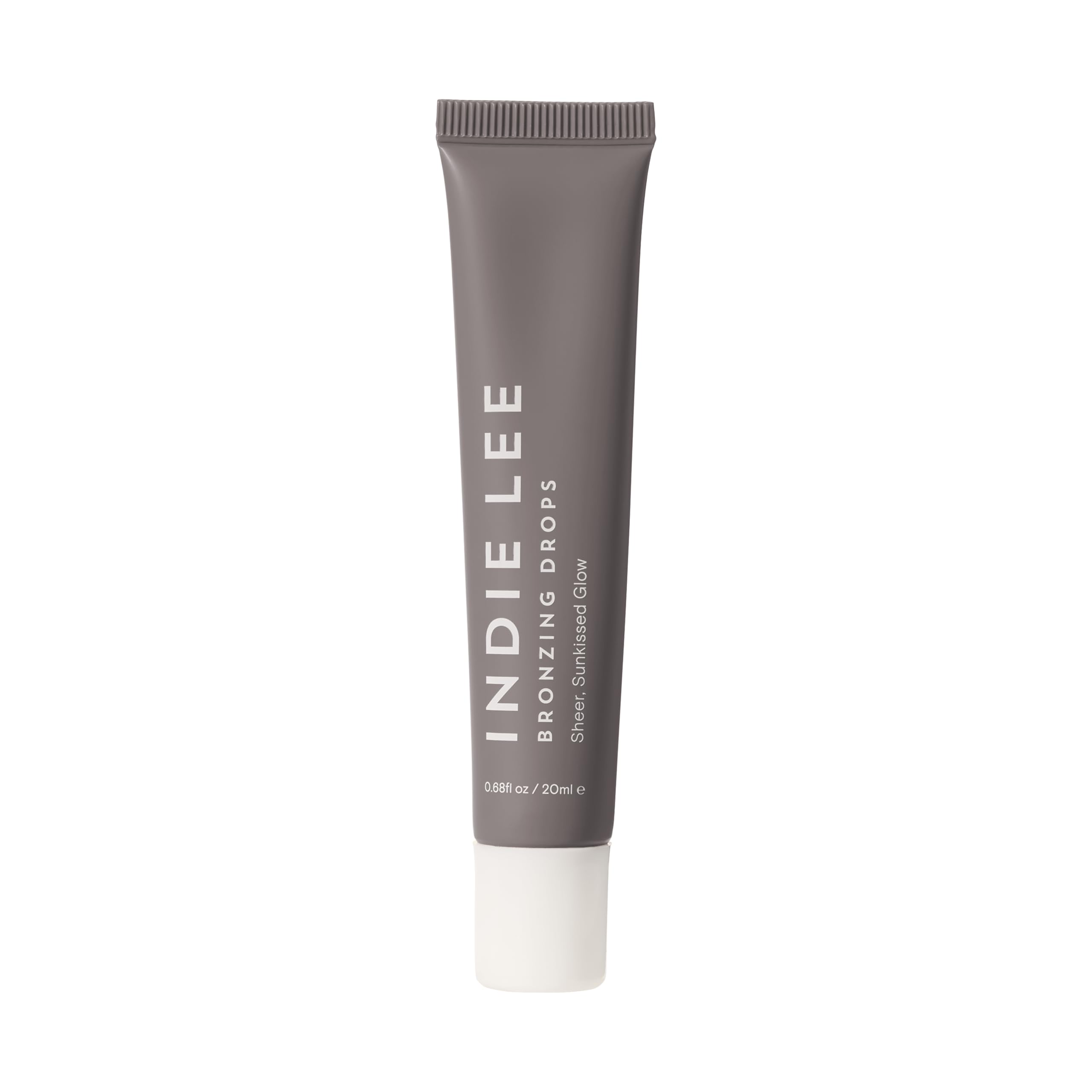 Indie Lee Bronzing Drops on face and body create a natural, hydrating glow.