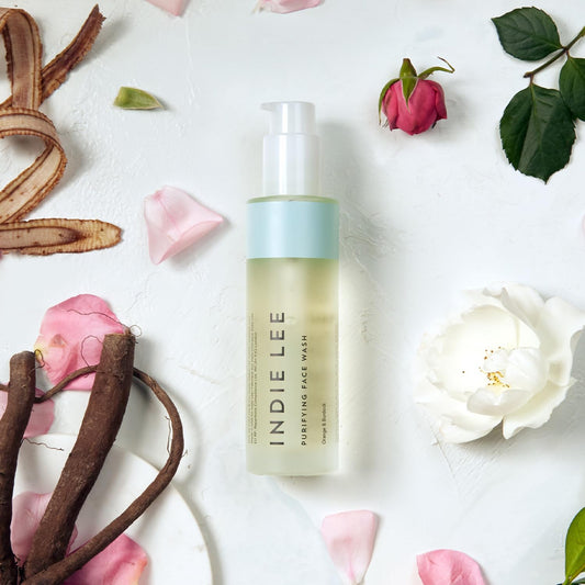 Close-up of Indie Lee Purifying Face Wash foaming lather for gentle cleansing.