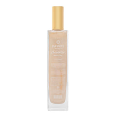 Infinite Beauty Shimmer Body Oil on skin with gold shimmer adds luxury