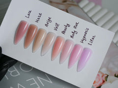 IN.HYPE peachy pink finish on nails highlighting a durable overlay.