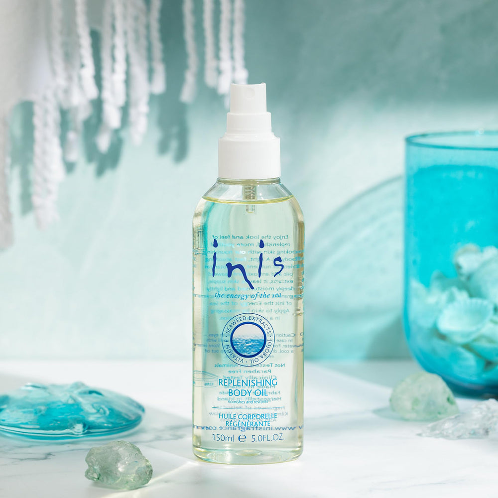 Inis Replenishing Body Oil spray dispensing smoothly for fast absorption.