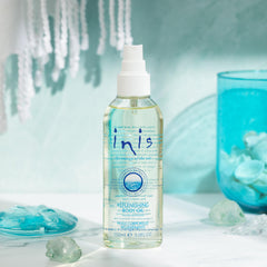 Inis Replenishing Body Oil spray dispensing smoothly for fast absorption.