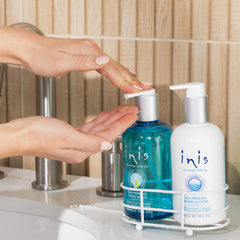 Inis hand lotion bottle with shea butter hydrates skin deeply.