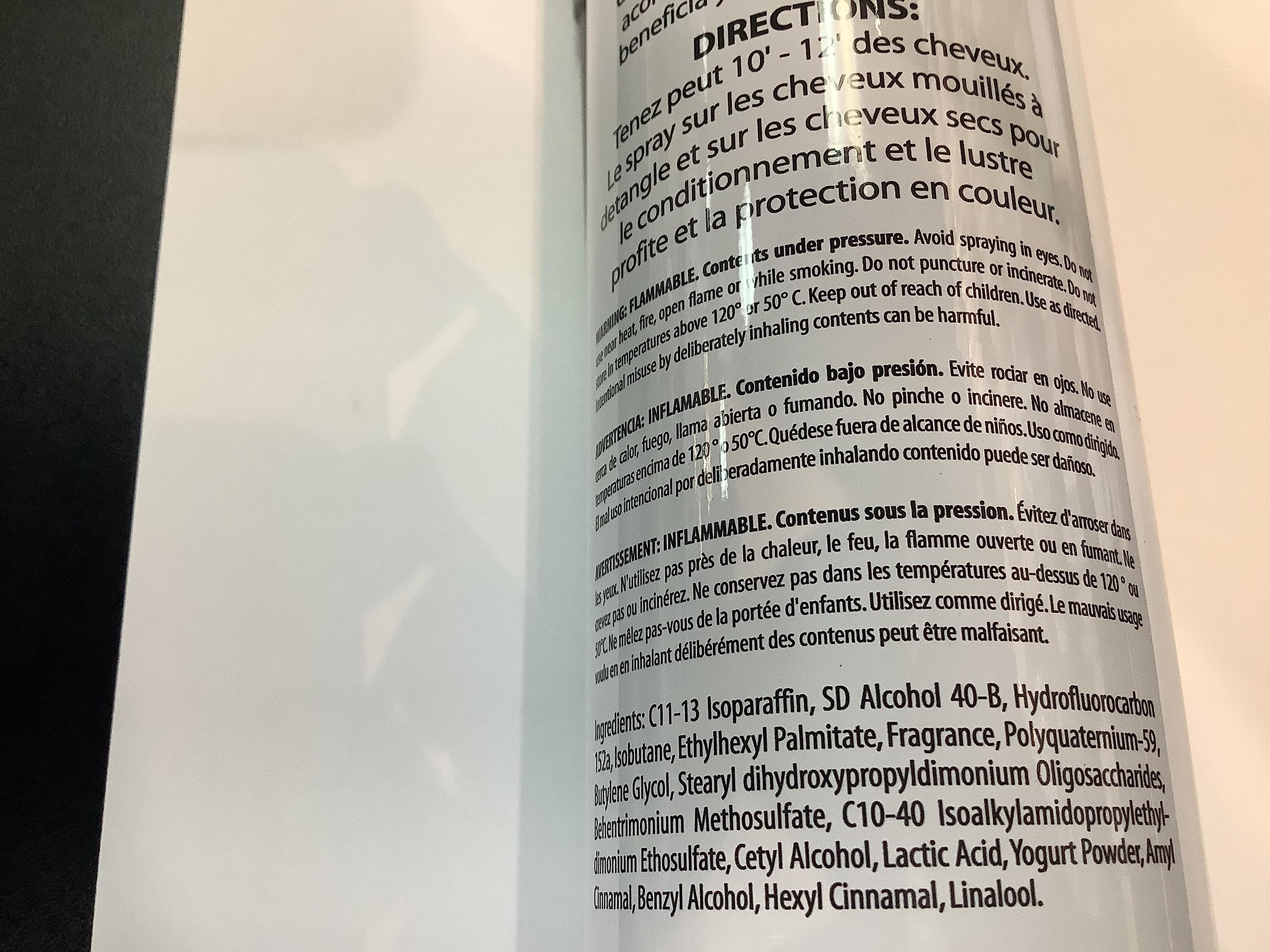 Inkursive Shuga Spray Leave-In Conditioner on a comb-ready hair close-up showing detangling
