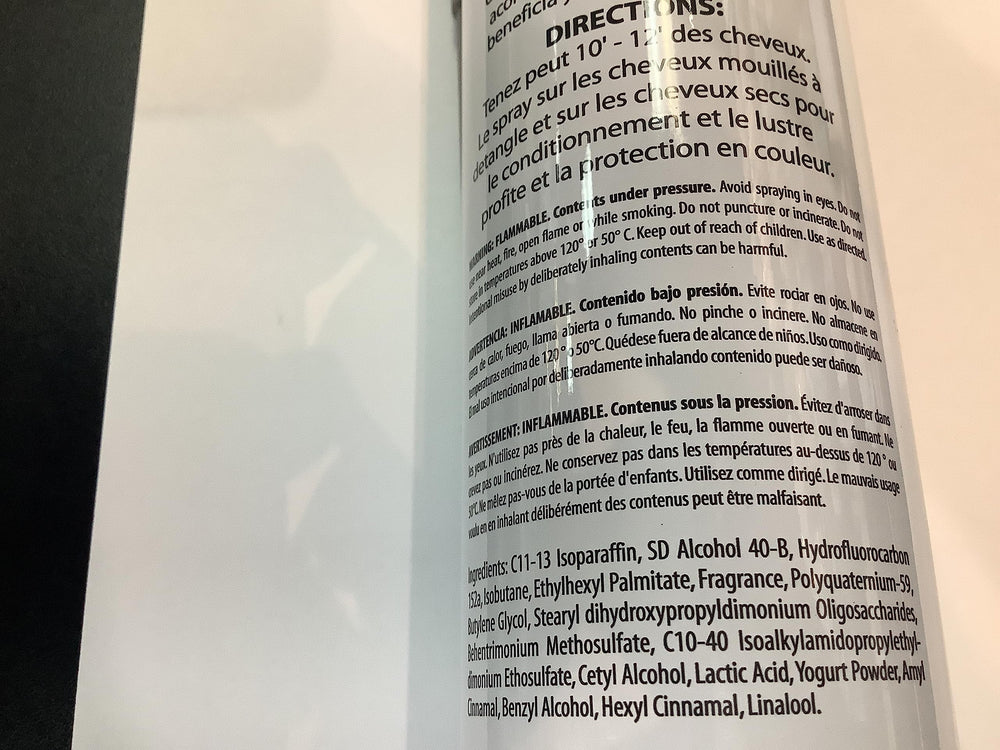 Inkursive Shuga Spray Leave-In Conditioner on a comb-ready hair close-up showing detangling
