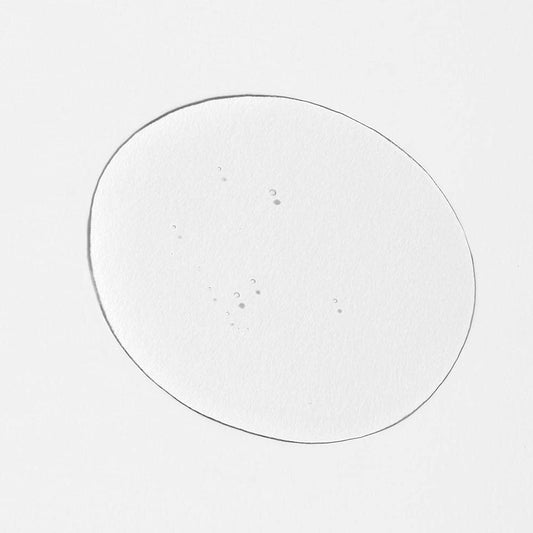 INNERSENSE Natural Harmonic Treatment Oil ingredients close-up, highlighting botanicals for skin and scalp balance.