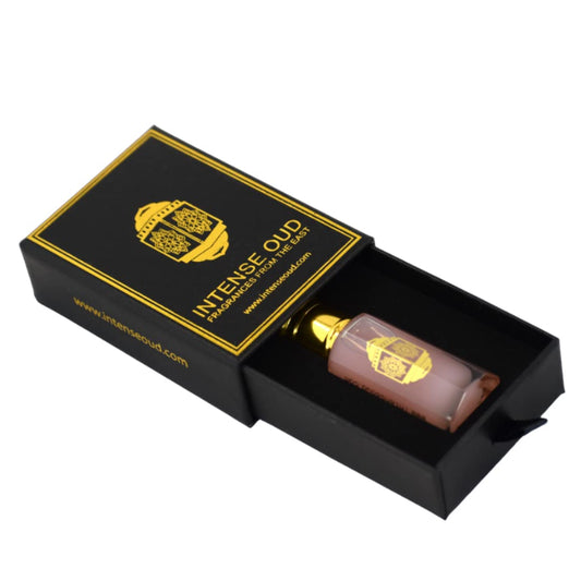 INTENSE OUD Pink Musk application on the wrist demonstrates portable, alcohol-free fragrance.