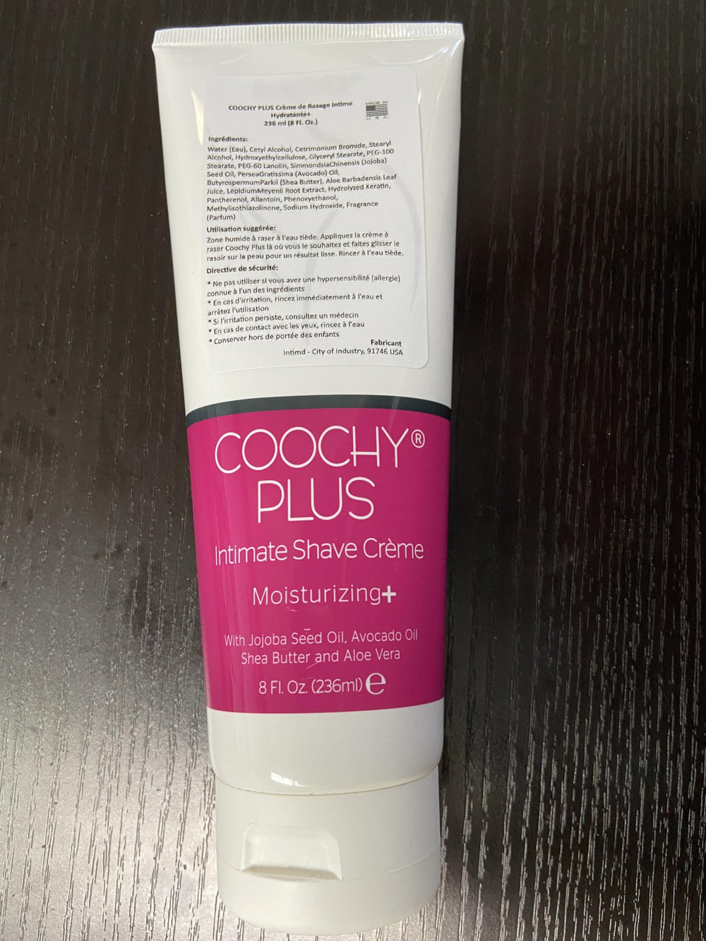 IntiMD Coochy Plus cream dispense reveals rich moisturizing formula for smooth passes.