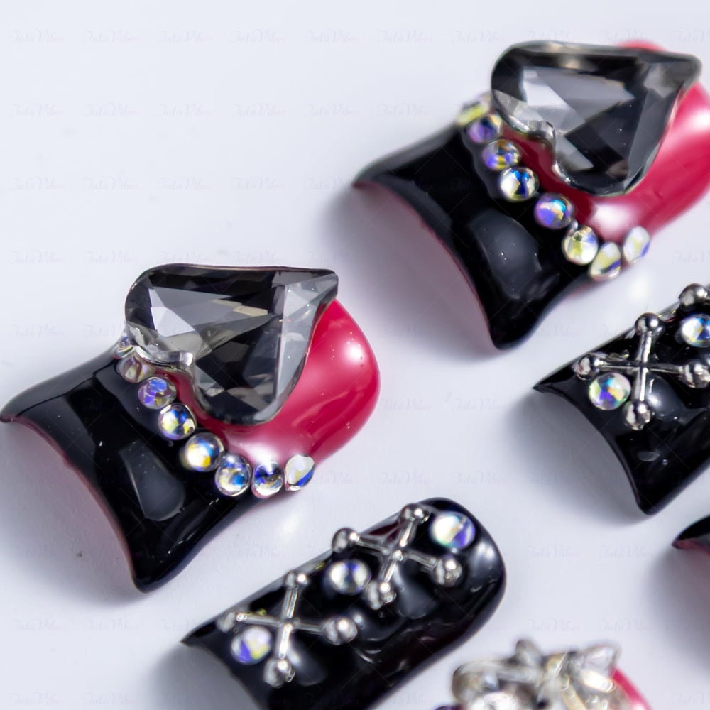 IntoVibes black hearts nail art enhances romantic style with subtle contrast.