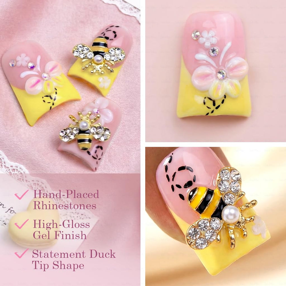 IntoVibes floral bee charms nails offer playful decorative detail.