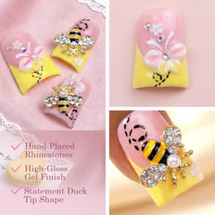 IntoVibes floral bee charms nails offer playful decorative detail.