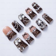 IntoVibes lace-texture detail nails close-up highlighting 3D texture.