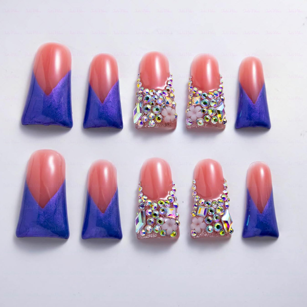 IntoVibes luxury purple shimmer duck-shape nails with crystal bling for a bold party look