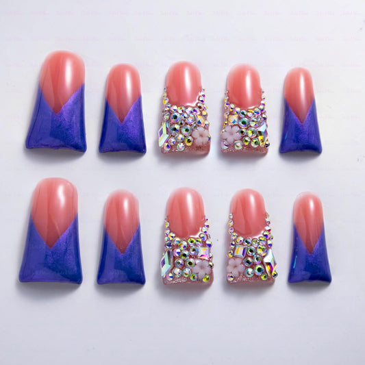 IntoVibes luxury purple shimmer duck-shape nails with crystal bling for a bold party look
