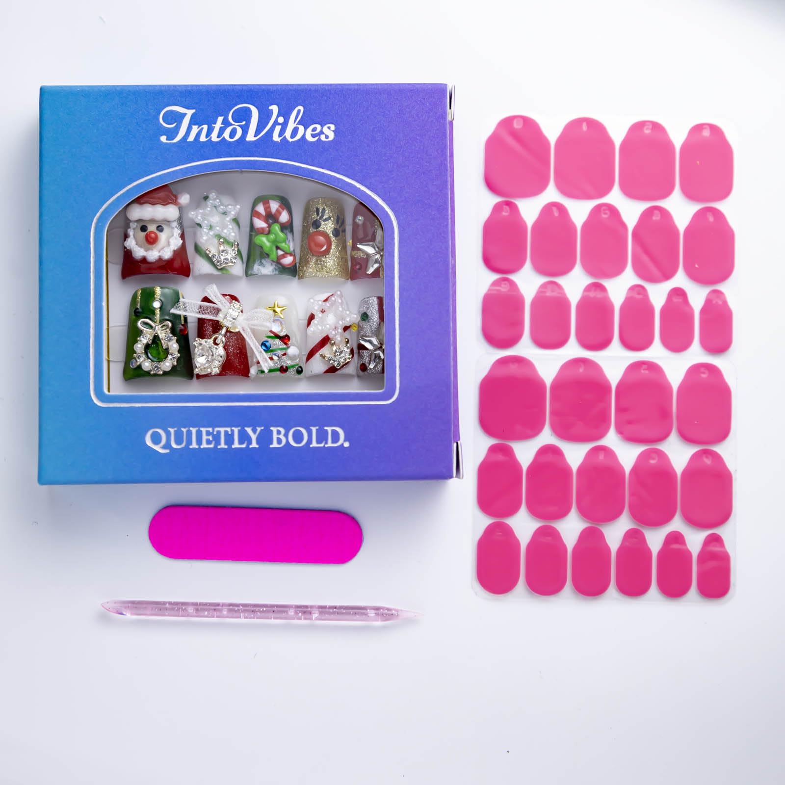 IntoVibes Christmas decor themed nails with Santa and tree accents.