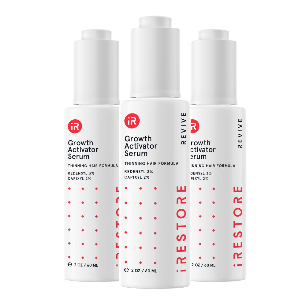 iRestore Scalp Serum bottle pour demonstrates easy, precise application for targeted scalp care.