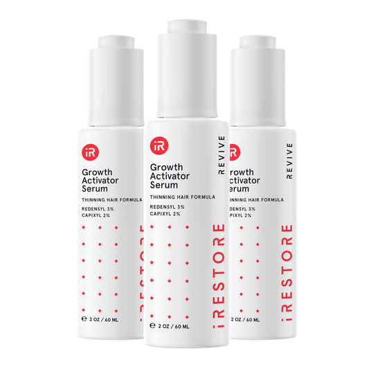 iRestore Scalp Serum bottle pour demonstrates easy, precise application for targeted scalp care.