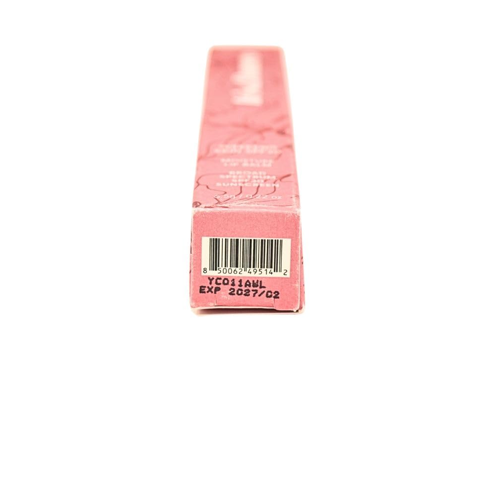 IRIS&ROMEO lip balm in outdoor light highlighting wearable shade and moisture.