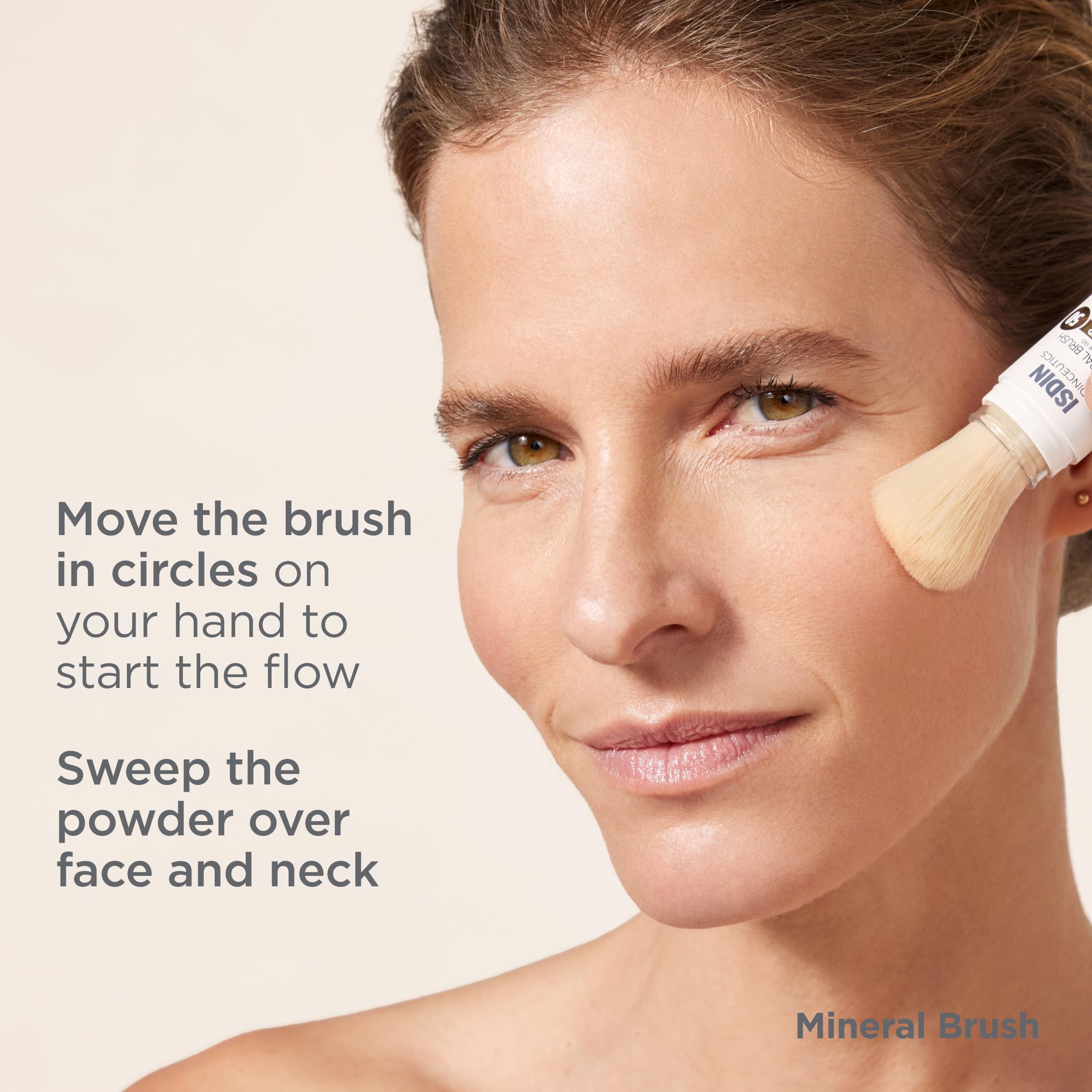 ISDIN Mineral Brush Powder priming on the back of the hand