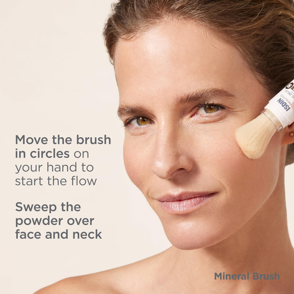 ISDIN Mineral Brush Powder priming on the back of the hand