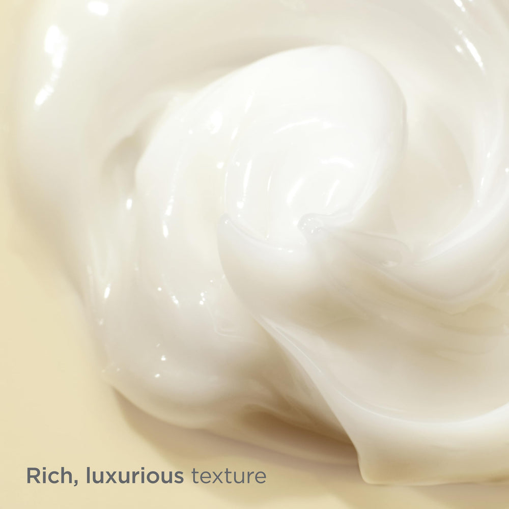 Cream texture on hand demonstrates rich hydration and smooth application.