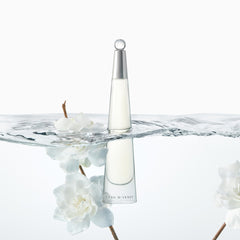 Packaging close-up shows elegant silhouette and metal cap.