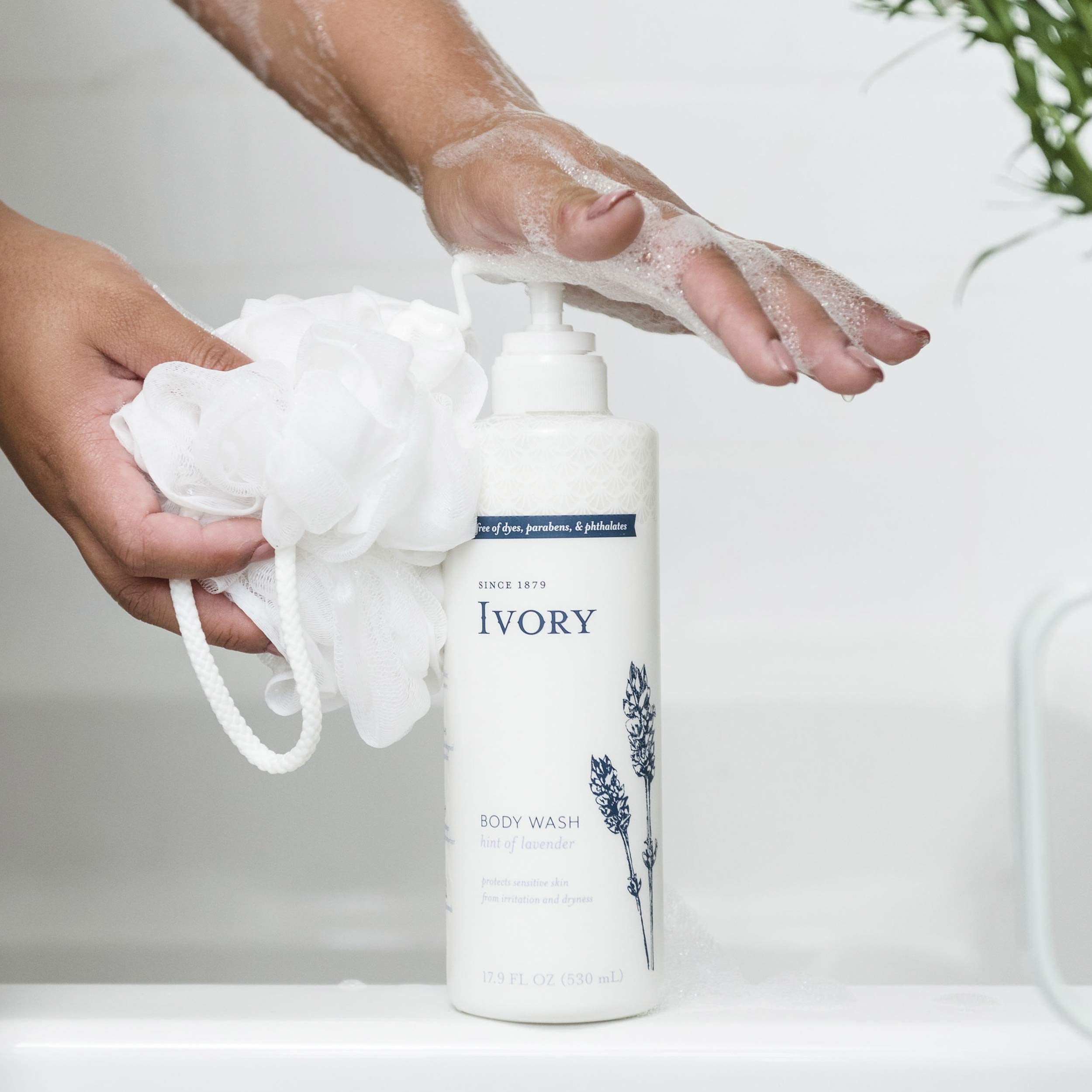 Ivory moisturizing wash being poured from bottle highlighting accessible daily care.